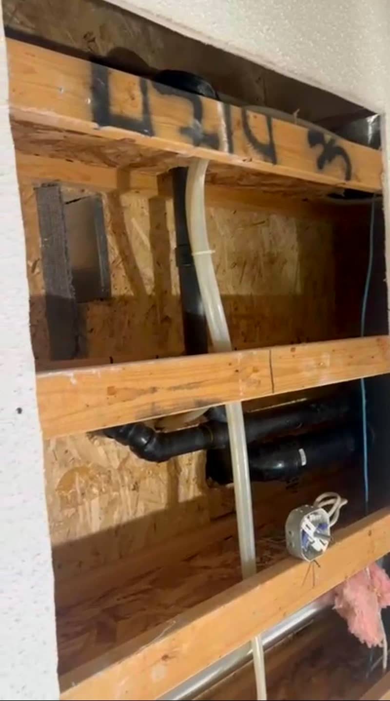 Ceiling opened to the joists, pipes and wiring exposed
