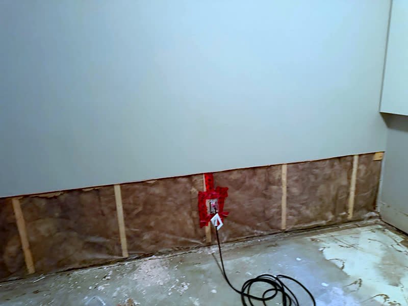 Flood cut along the lower wall with insulation exposed