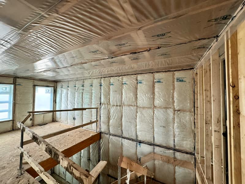 New home with batt insulation installed in walls and ceiling